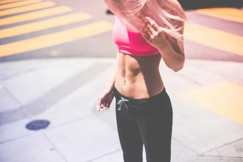 Woman with toned stomach after LA-EMS Body Sculpting Treatment Wales